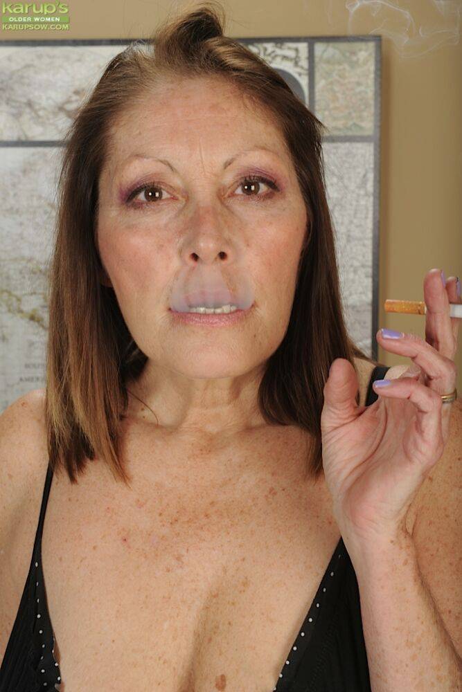 Older broad Jane McWilliams enjoying a smoke while fondling big boobs - #10