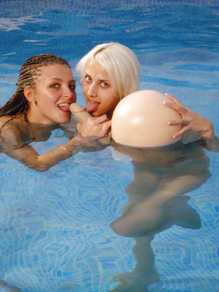 Petite teenage chicks have some lesbian fun using their toys in the pool - #2