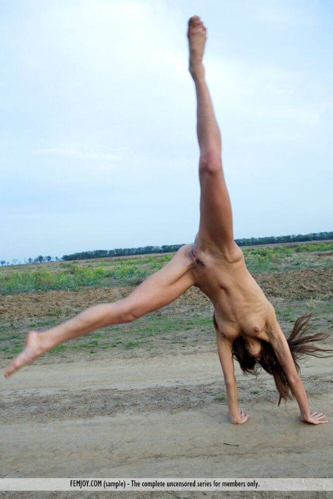 Charming teen Alannis does cartwheels on a dirt road in the nude - #9