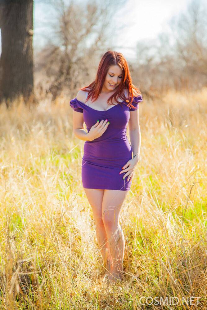 Hot redhead Raven removes her tight dress in a field to flaunt her fat body - #16