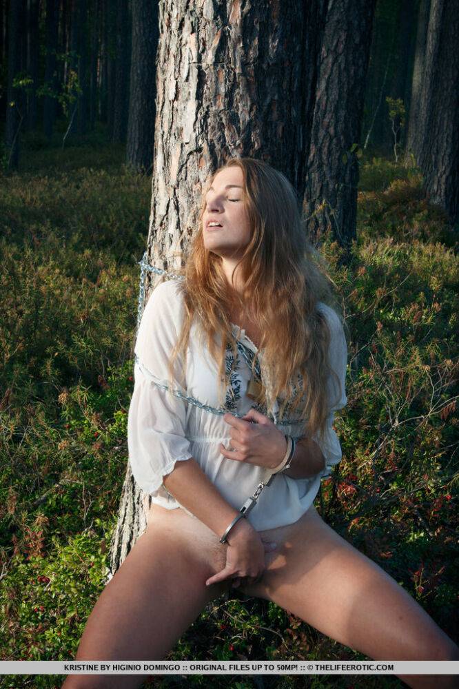 Handcuffed teen Kristine masturbates while being chained to a tree in woods - #13