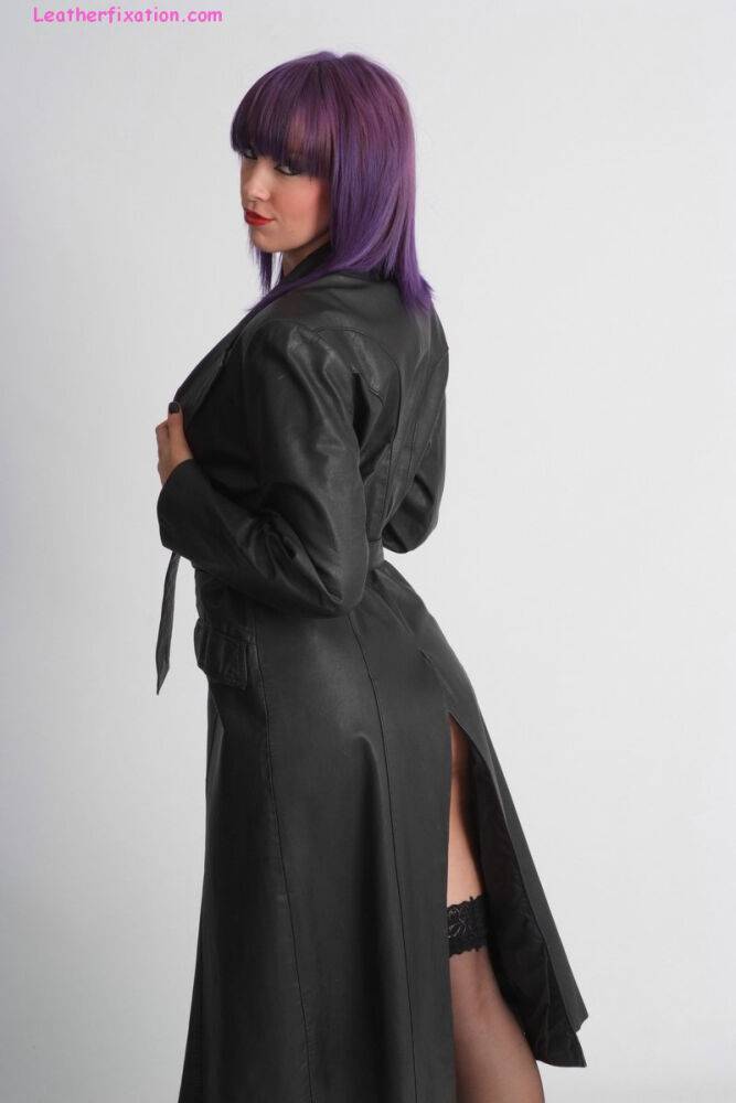 Tall female Sammi frees her firm tits from a leather trench coat in hosiery - #6