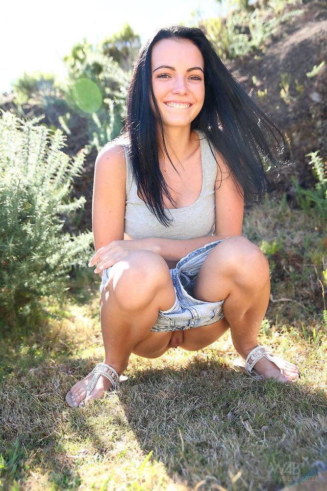 Dark haired girl finds herself in a field and needing to take a piss - #16