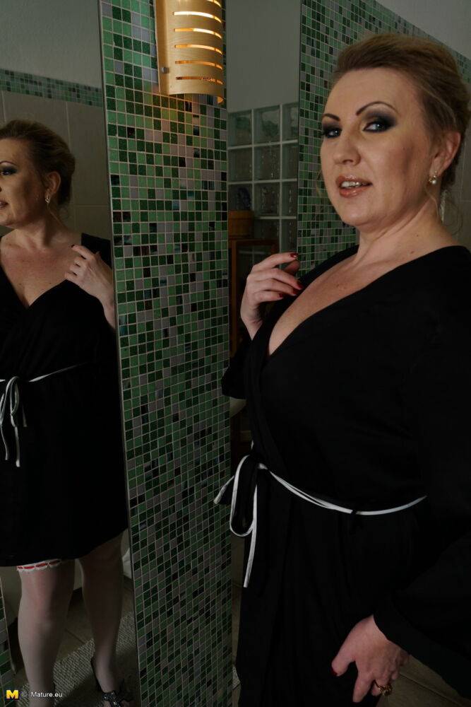 Older woman with a few extra kilos on her frame strips to stockings for a bath - #9