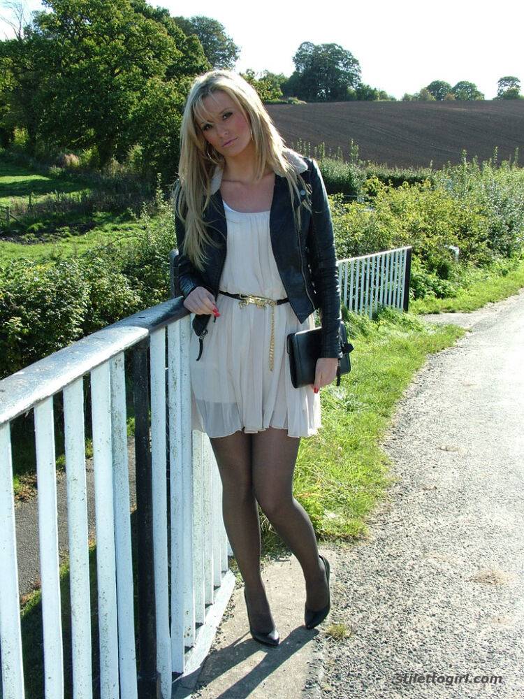 Non nude outdoor posing from a tremendous blondie in a tight skirt Erin - #4