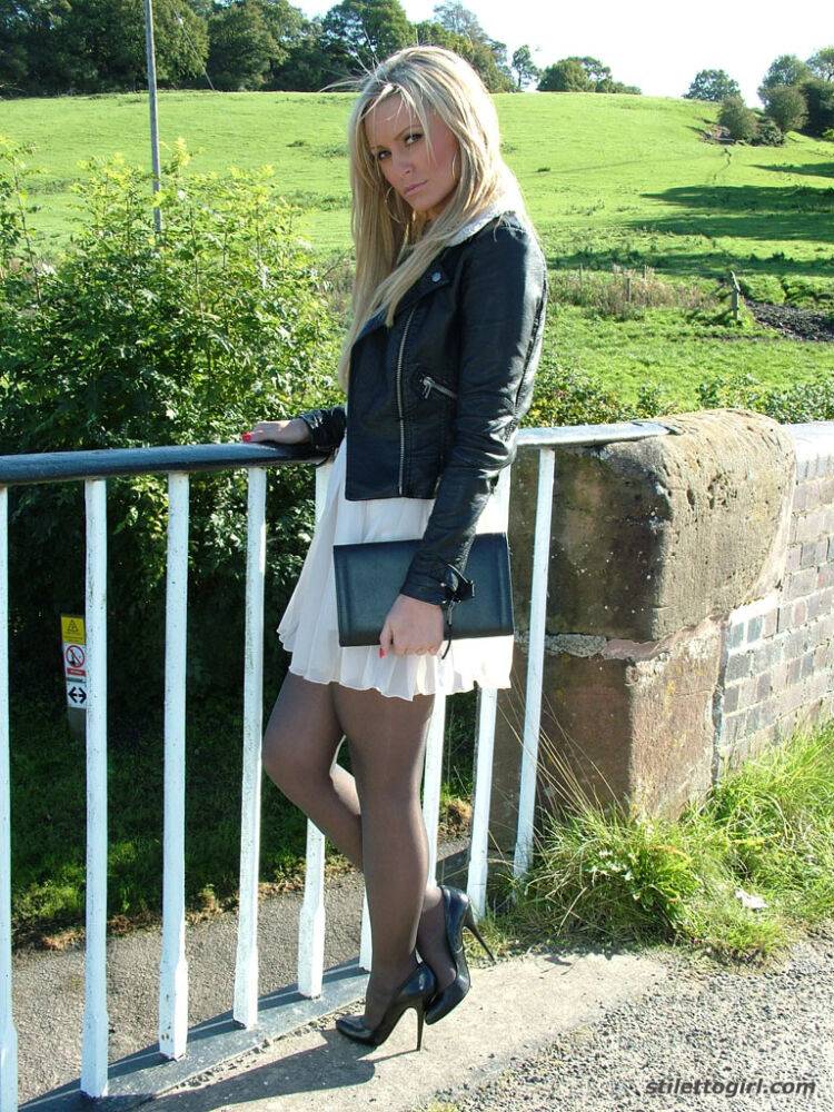 Non nude outdoor posing from a tremendous blondie in a tight skirt Erin - #13