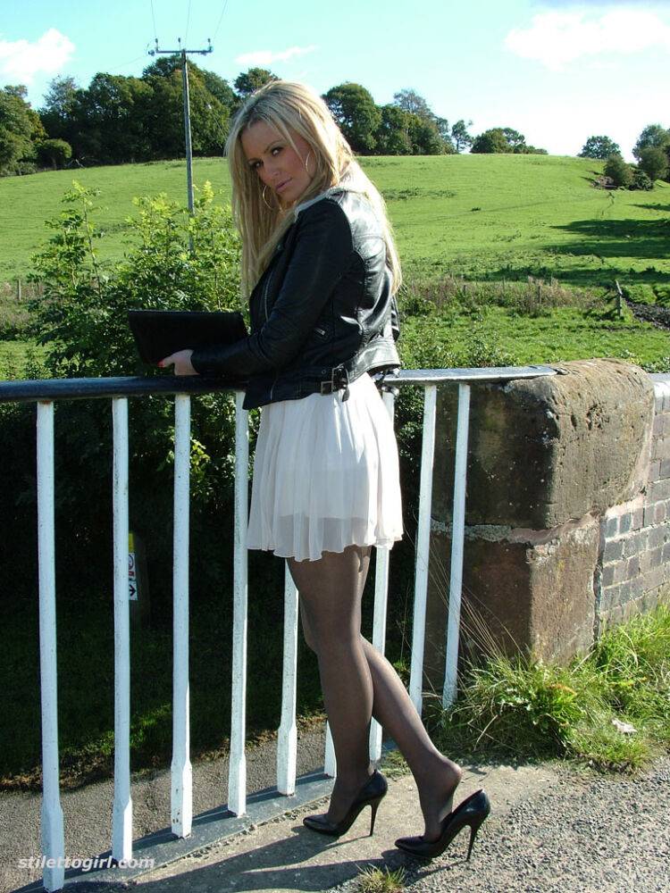 Non nude outdoor posing from a tremendous blondie in a tight skirt Erin - #9