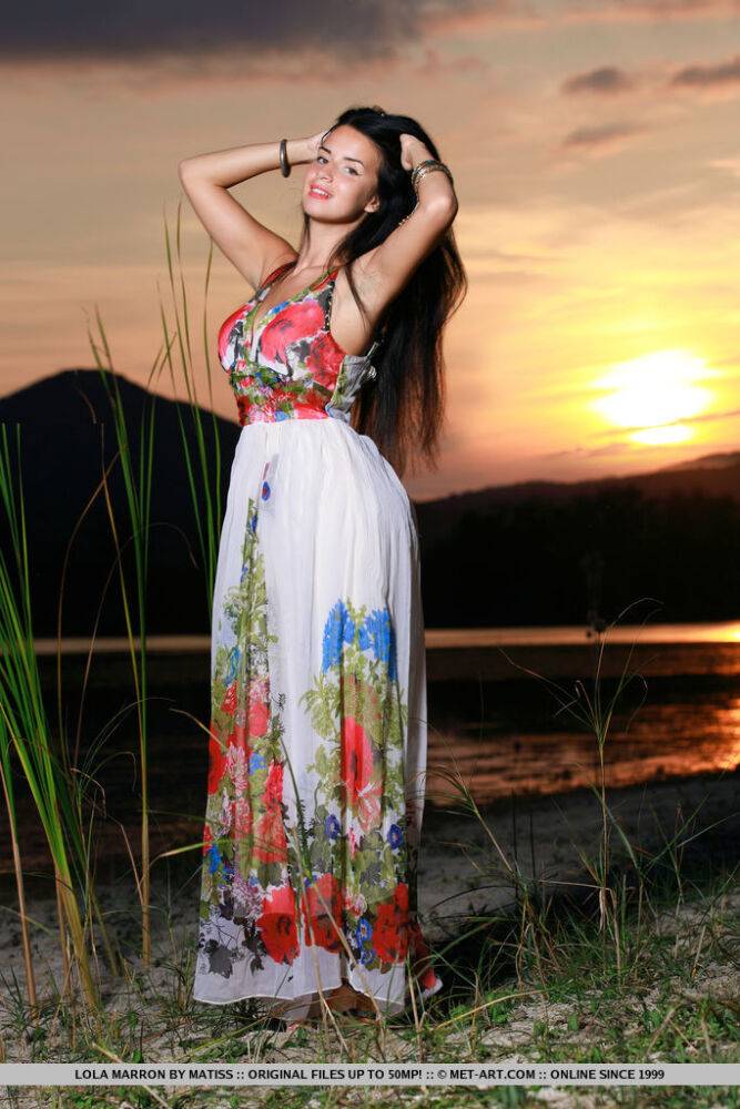 Dark-haired teen Lola Marron slips out of a long dress to pose nude at sunset - #3