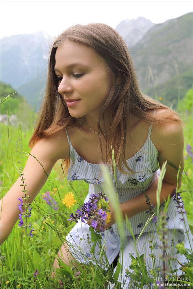 Pretty girl gets totally naked on a blanket upon an Alpine slope - #4