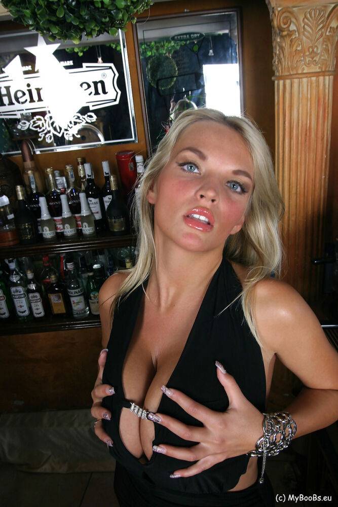 Blonde chick Ines Cudna exposes a large breast while tending bar - #10