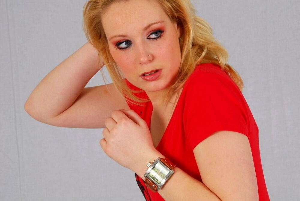 Strawberry blonde Sanne shows off a big Geneva watch during a non-nude scene - #12