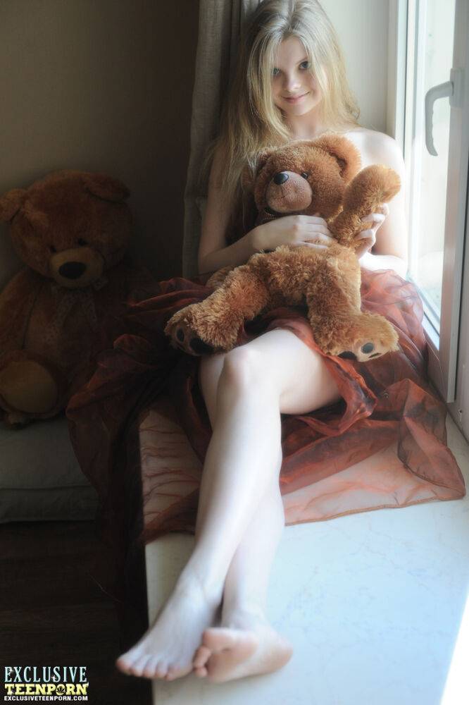 Tiny teen Kisa strikes tempting nude poses while holding a teddy bear - #7