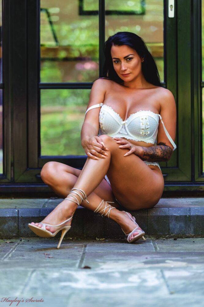 Inked UK model Kelli Smith bares her great body in heels outside a patio door - #4