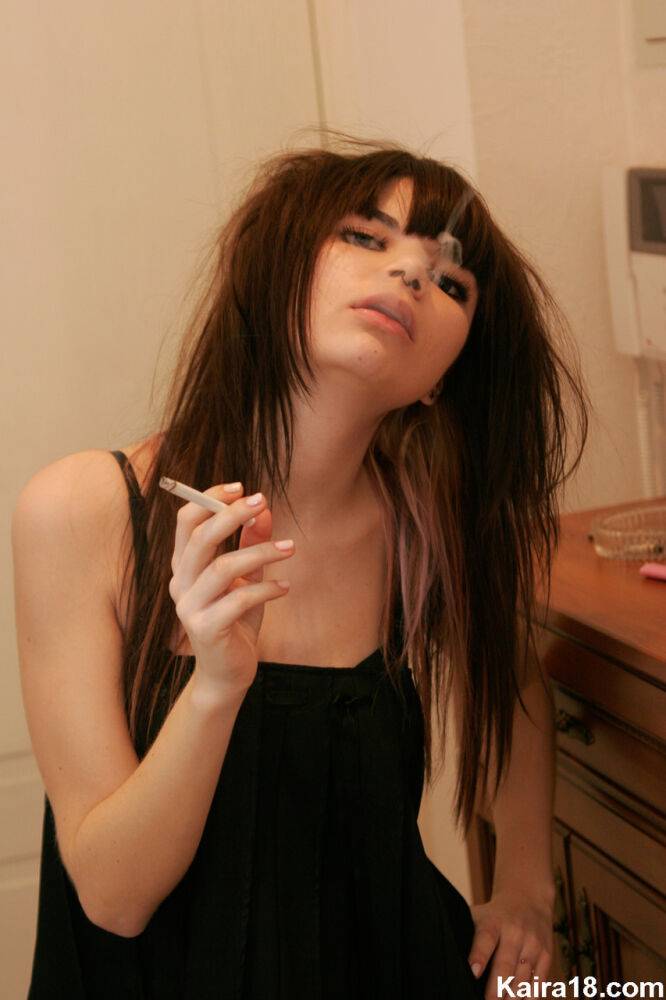 Skinny teen Kaira 18 smokes a cigarette before stripping naked - #8