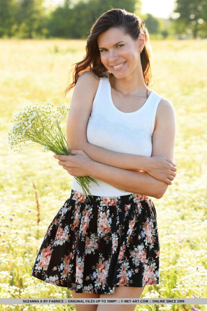 Young brunette Suzanna A stands naked after disrobing in field of wildflowers - #15