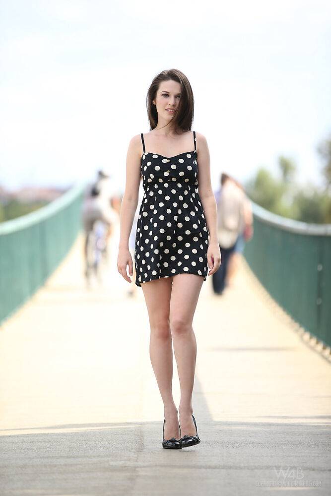 Solo girl removes her polka dot dress while out for a walk in public - #14