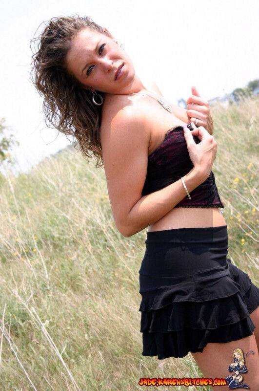 Teen amateur shows some cleavage during a SFW shoot out in a field - #9