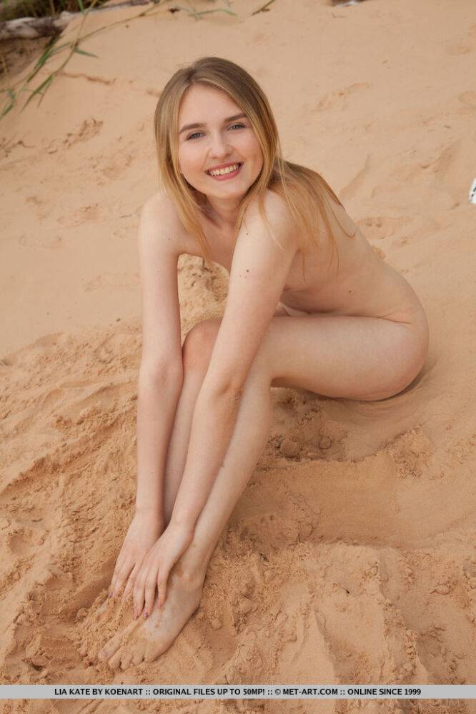 Cute teen girl Lia Kate gets totally naked on a sandy beach - #8