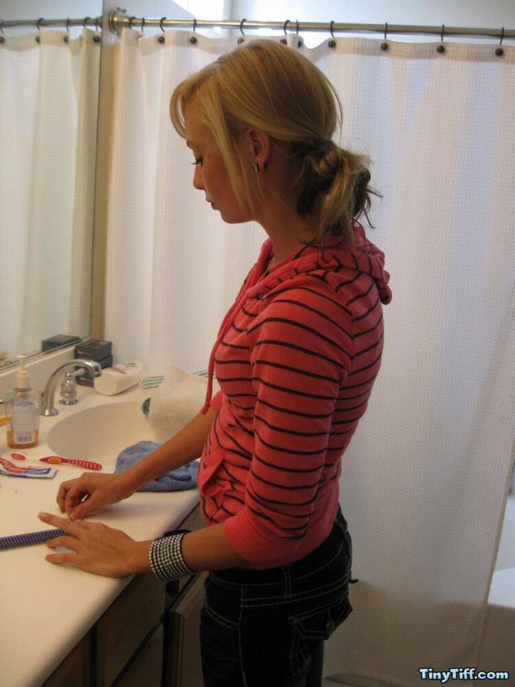 Blonde amateur Tiny Tiff sports a whale tail while doing her hair in a mirror - #13