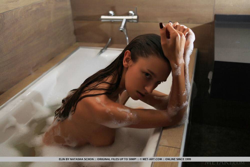 Alluring teen Elin displays her firm tits while taking a bubble bath - #11