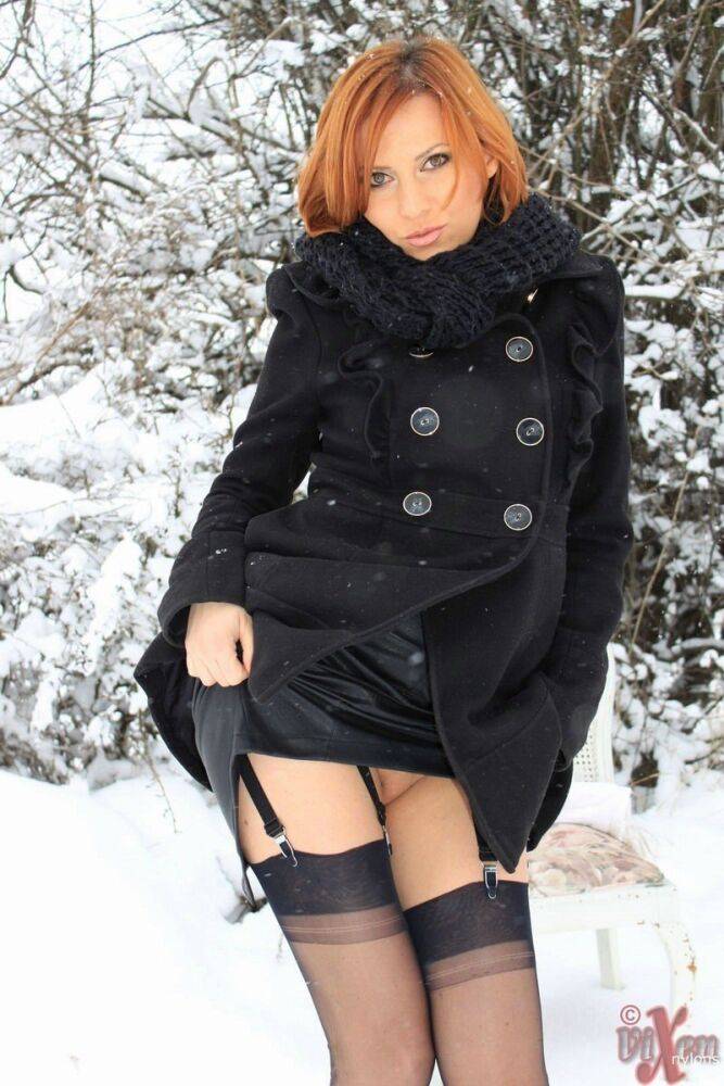 Sexy Vixen Nylons plays in the snow like a sex kitten in stockings - #12