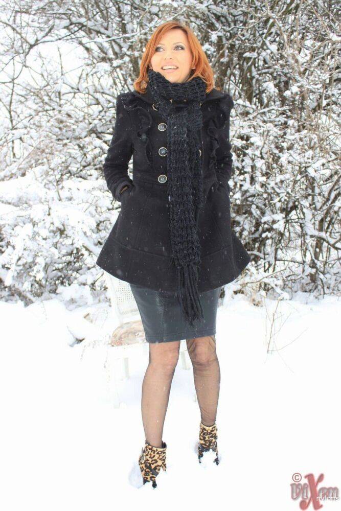 Sexy Vixen Nylons plays in the snow like a sex kitten in stockings - #11