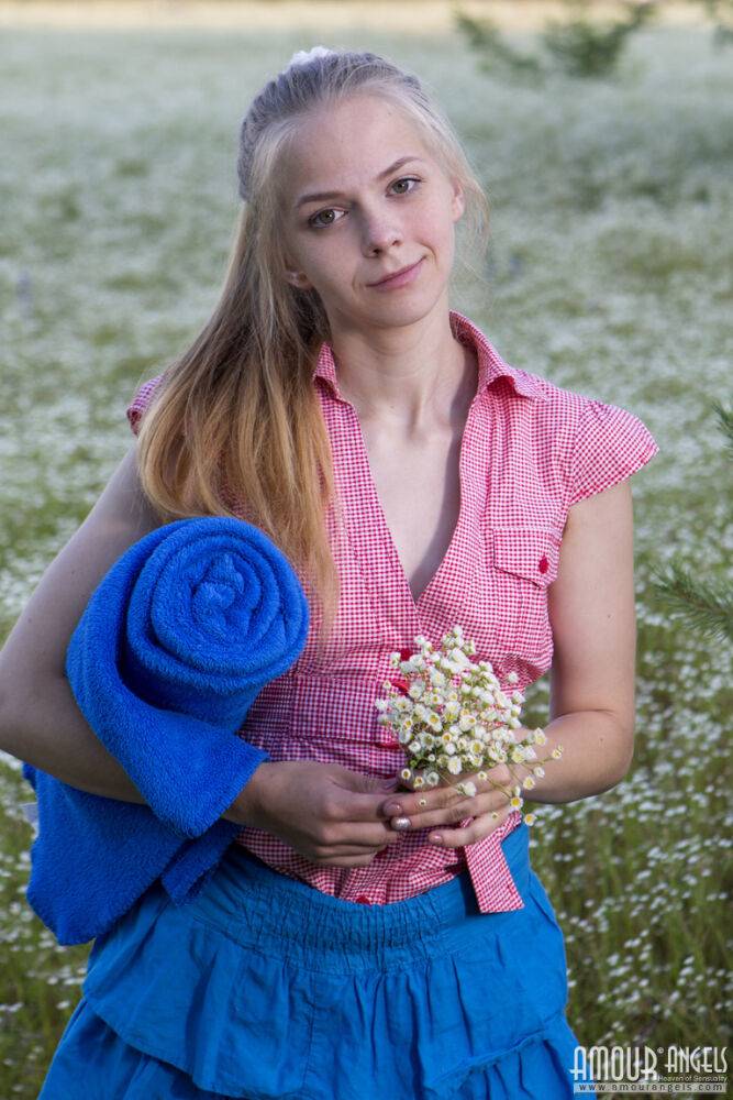 Blond teen Nastyshka spreads a blanket in a field before getting totally naked - #7