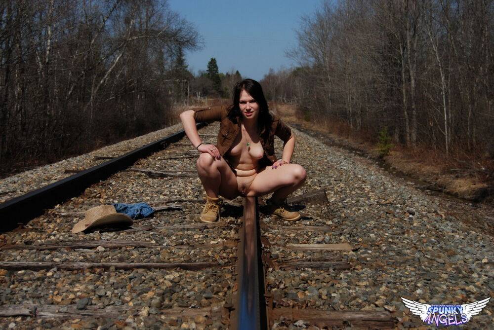 Young amateur Emily Love exposes herself on railway tracks in a hat and boots - #7