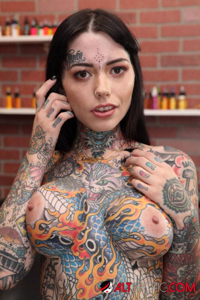 Heavily tattooed girl Tiger Lilly gets a new tattoo while completely naked - #14