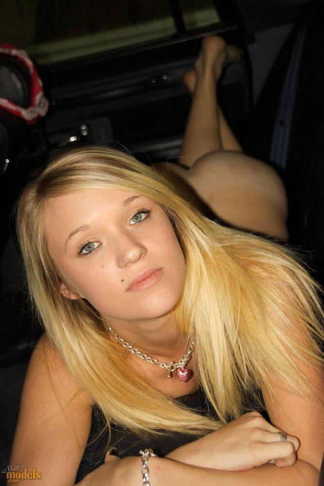 Blonde amateur Teagan slides lace panties aside to get naked inside a vehicle - #16