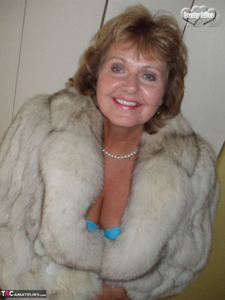 Mature amateur Busty Bliss exposes her tan lined tits while wearing a fur coat - #4