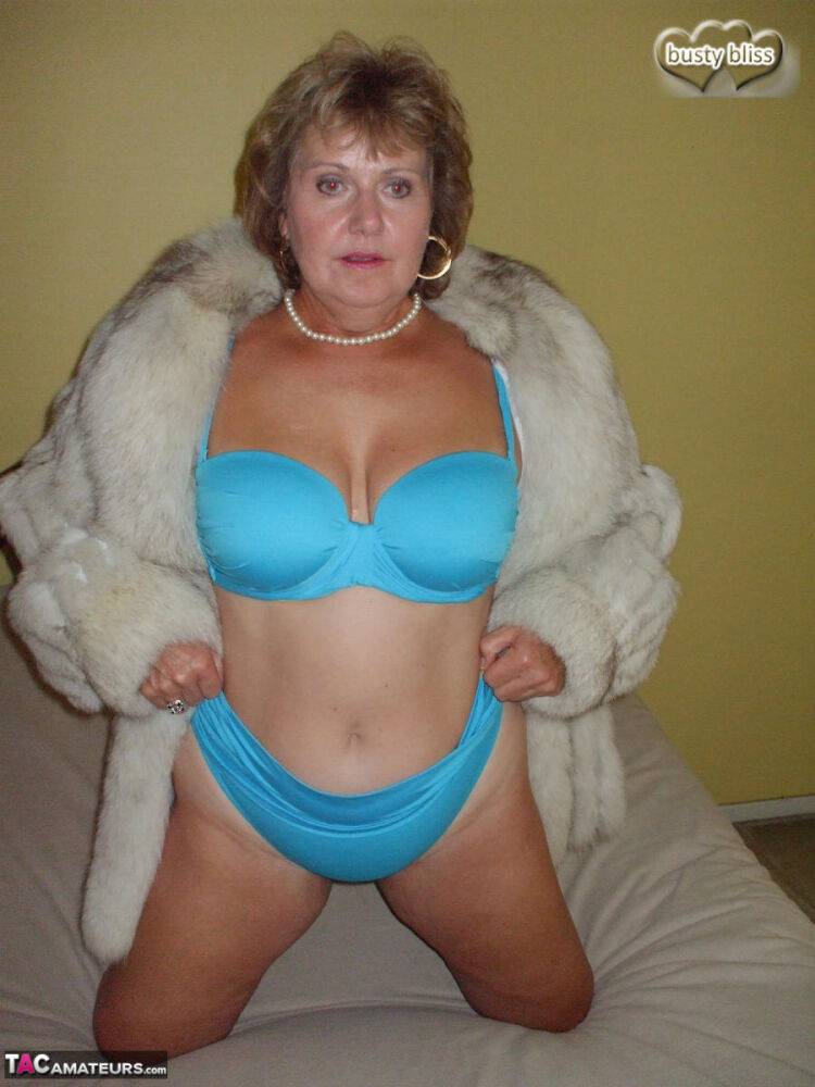 Mature amateur Busty Bliss exposes her tan lined tits while wearing a fur coat - #13