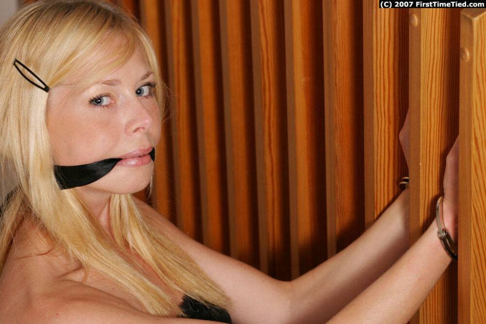 Clothed blonde girl is subdued with a cleave gag and handcuffs - #3