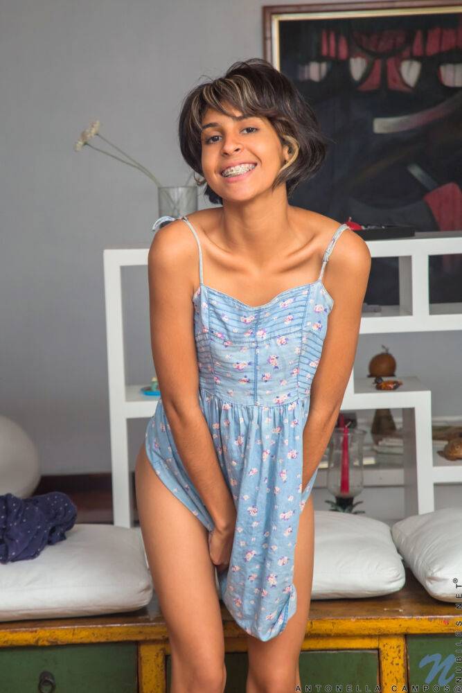 Latina teen Antonella Campos sports short hair while posing nude on a dresser - #2