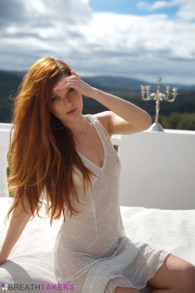 Pale redhead Mia Sollis slips out of a see thru dress to pose nude on balcony - #3
