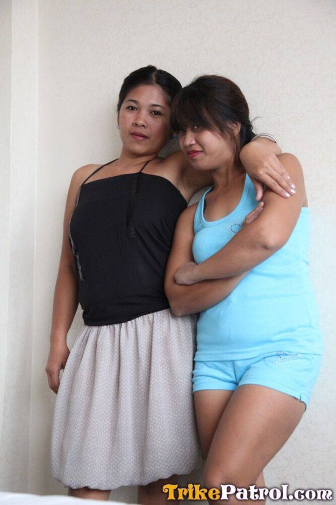 Asian ladies Che and Charm pose in motel for a sex tourist - #13