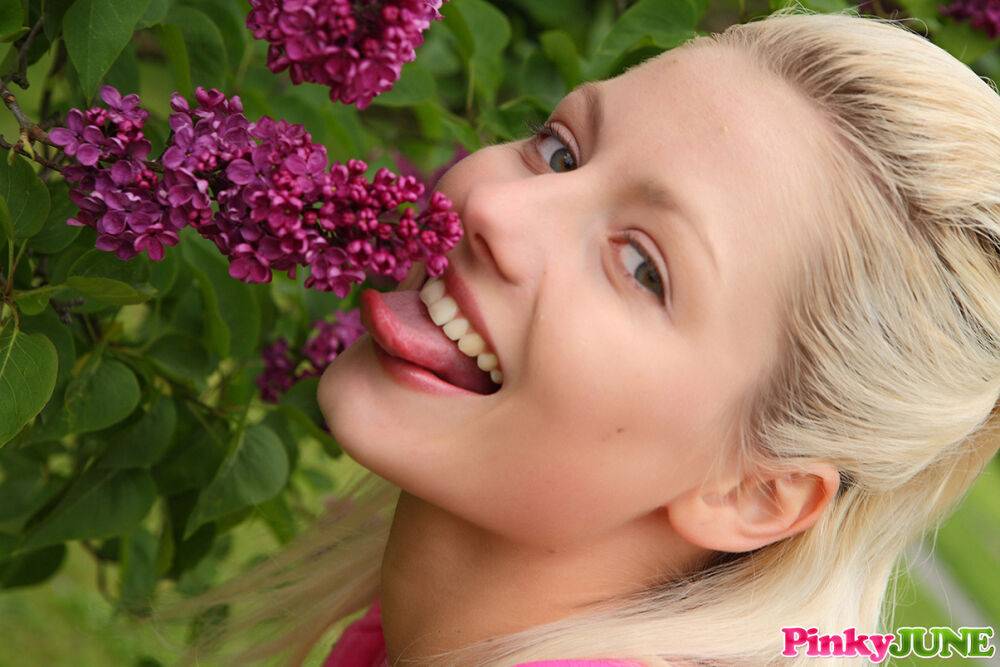 Young blonde Pinky June smells the flowers before masturbating on a lawn - #11