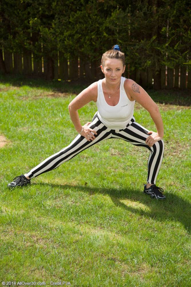 Athletic middle-aged woman strips naked in kitchen after working up a sweat - #2