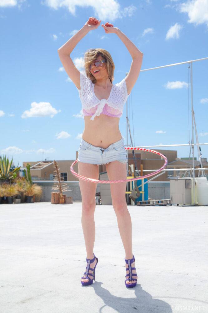 Amateur model Kylie K takes off her clothes outside while working a hula hoop - #15