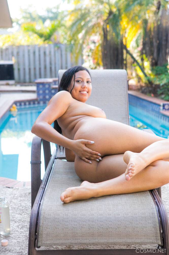 Chubby black amateur removes her bikini to pose nude on chair by a pool - #2