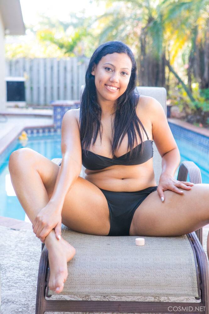 Chubby black amateur removes her bikini to pose nude on chair by a pool - #5