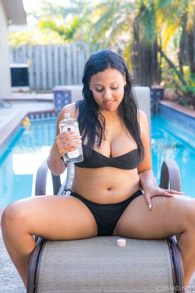 Chubby black amateur removes her bikini to pose nude on chair by a pool - #16