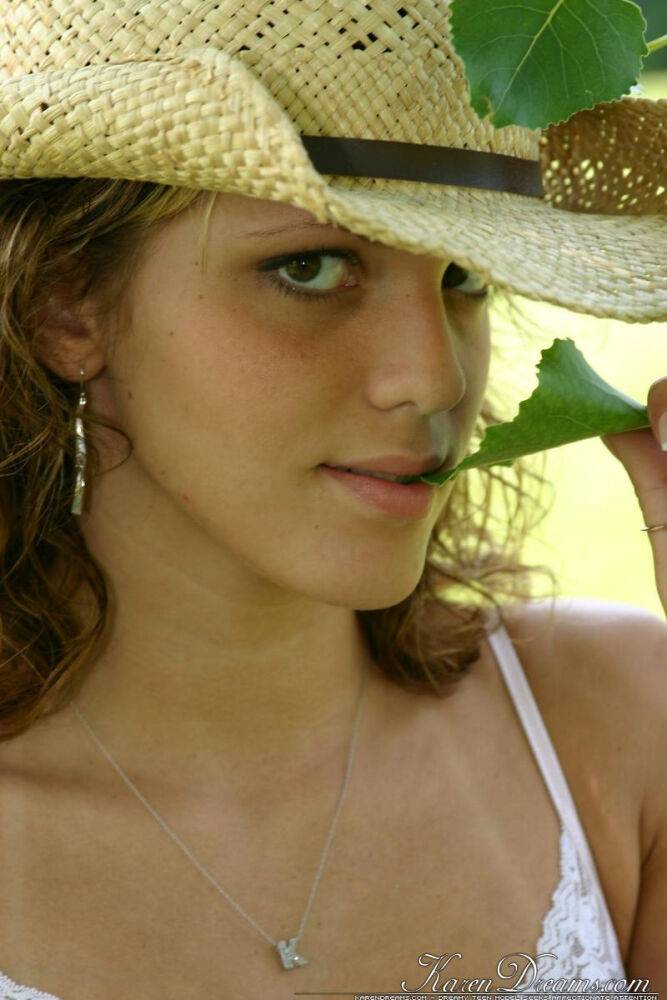 Amateur girl in a straw hat exposes her upskirt thong out on the lawn - #2