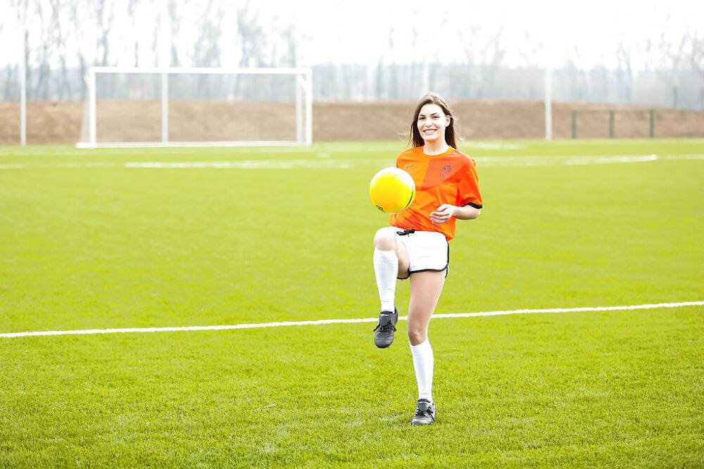 Lilly P is undressing her soccer uniform while on the field with a ball - #2