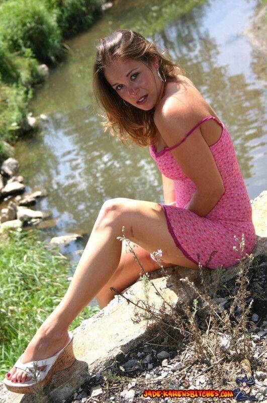 Amateur girl exposes upskirt underwear while near a slow-moving river - #1