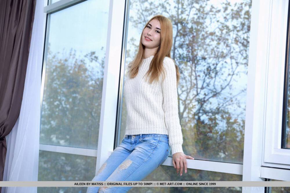 Tall beauty Aileen doffs jeans and sweaters by a window to model in the nude - #16