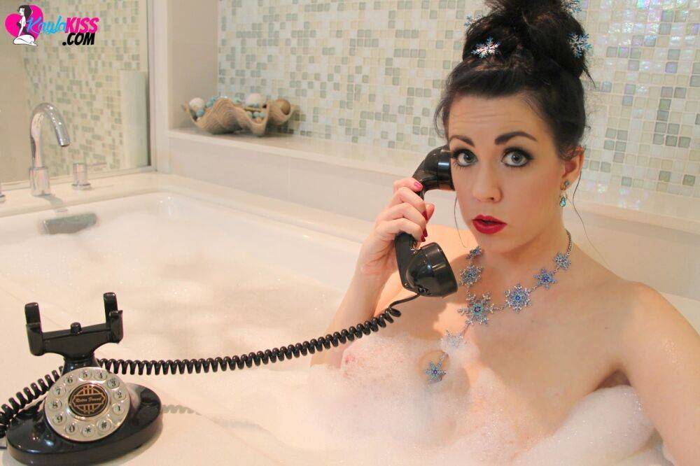 Busty brunette with red lips Kayla Kiss takes a phone call during bubble bath - #5