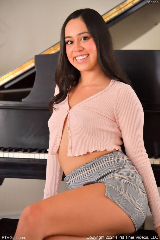 Smiling teen Merisol pleasures her bald pussy on a piano bench - #4