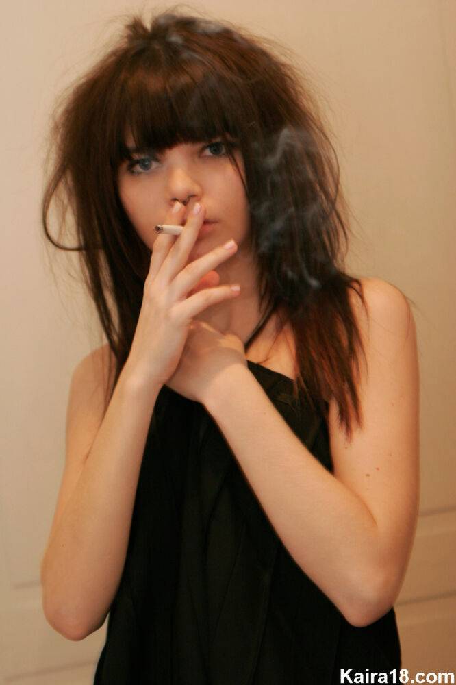 Petite girl Kaira 18 smokes while getting totally naked behind a closed door - #14