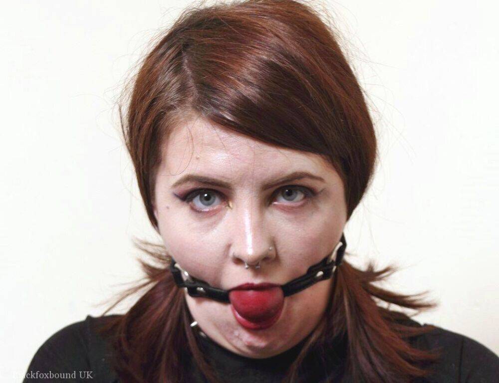 Tattooed redhead Luna La Roux sports a ball gag while restrained with straps - #1